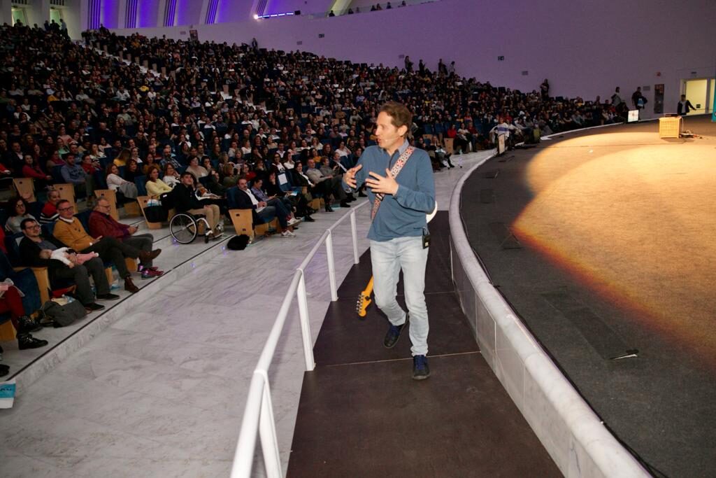 SalvaROCK interacting with an audience in a large amphitheatre
