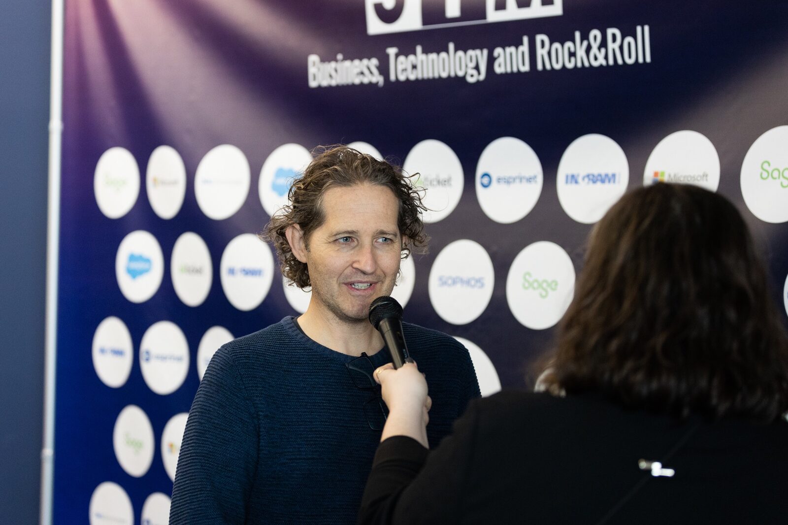 SalvaROCK in conversation during a business and technology event