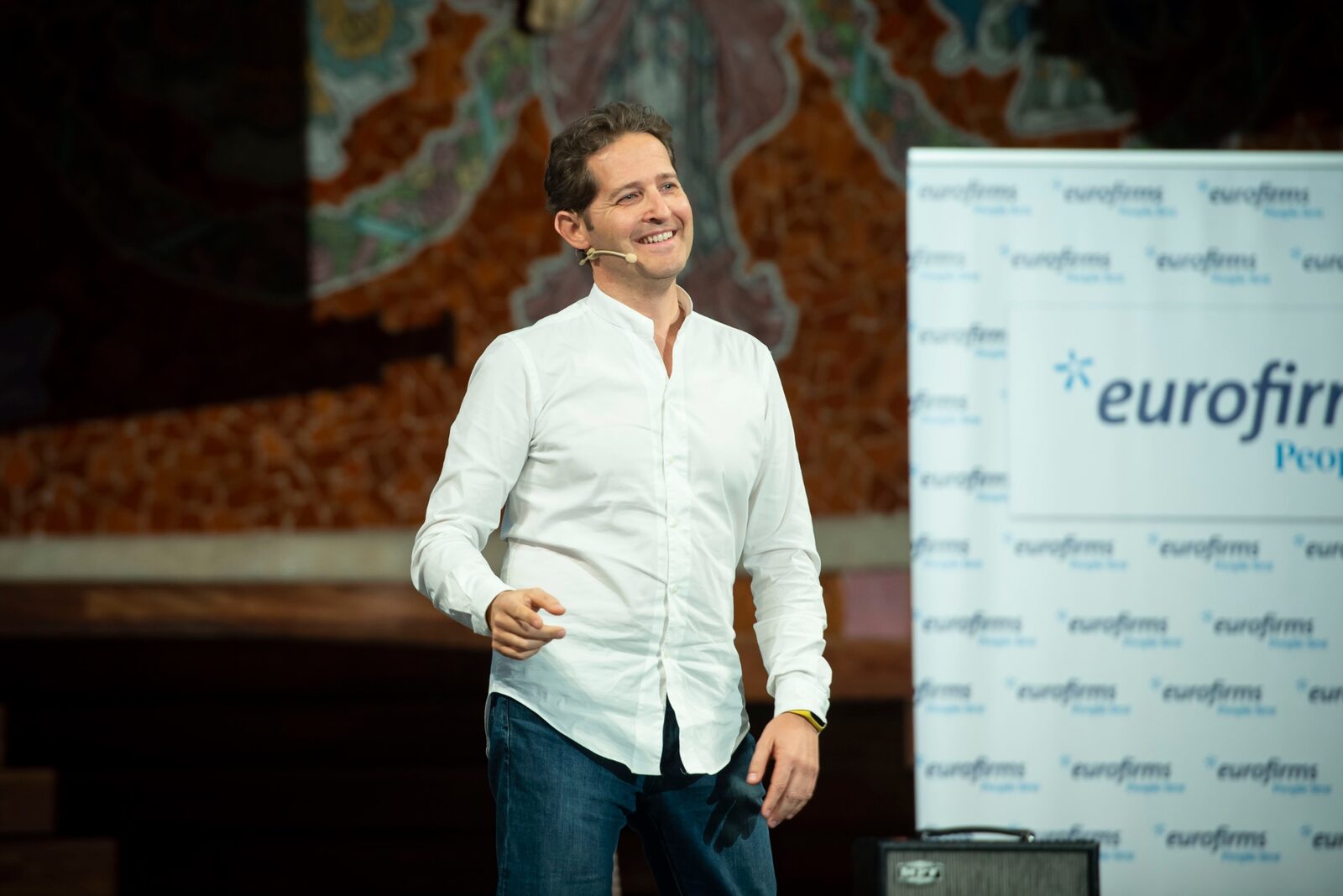 SalvaROCK smiling during a corporate keynote
